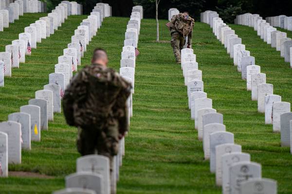 Photos: Flags placed at cemeteries to honor fallen servicemembers for Memorial Day 2024