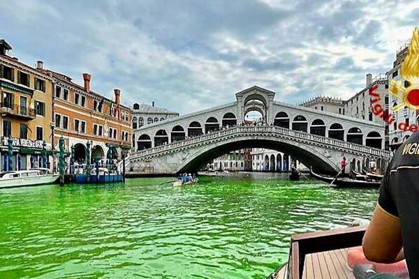 Officials investigating after Venice’s Grand Canal turns fluorescent green