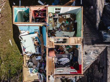 MADISON, TENNESSEE - DECEMBER 10: In an aerial view, the interior of a home is seen after its roof has been torn off in the aftermath of a tornado on December 10, 2023 in Madison, Tennessee. Multiple long-track tornadoes were reported in northwest Tennessee on December 9th causing multiple deaths and injuries and widespread damage. (Photo by Jon Cherry/Getty Images)